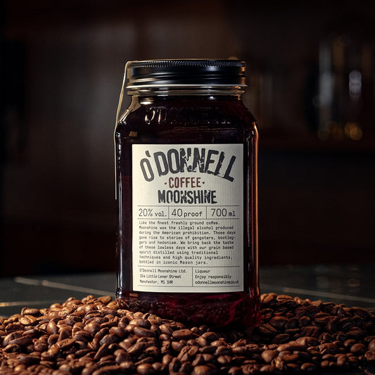 O'Donnell Coffee on a table with coffee beans