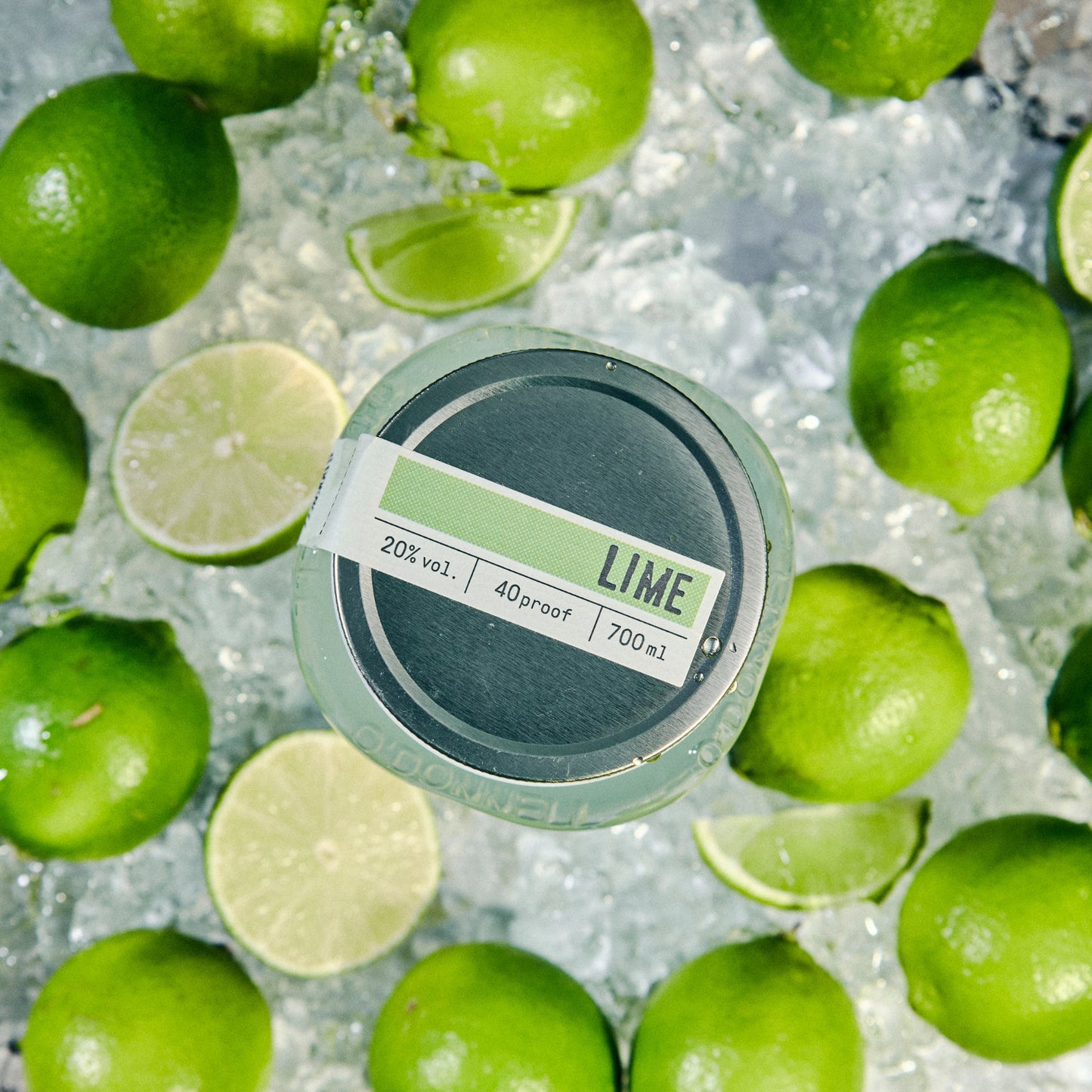 Lime Moonshine jar labelled 'Lime' surrounded by green limes on ice.