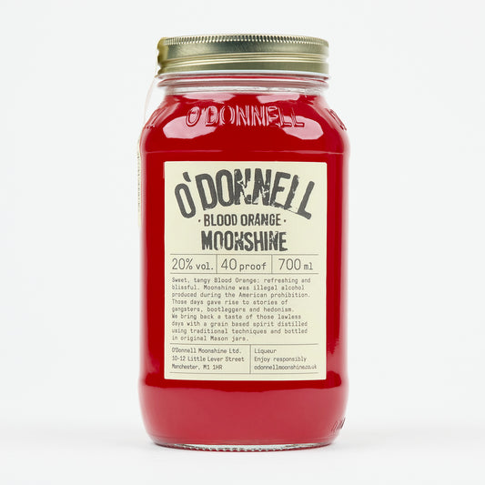 Red jar of O'Donnell Blood Orange Moonshine with a gold lid on a white background