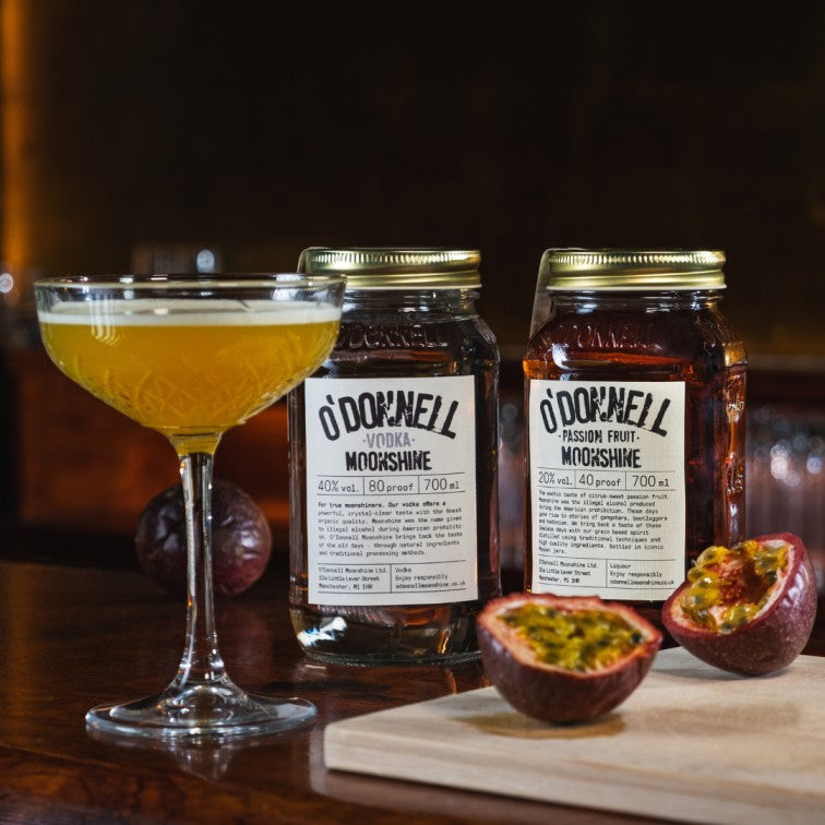 Vodka Moonshine alongside Passion Fruit Moonshine and a martini cocktail