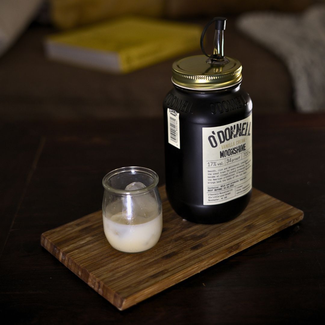 Jar of O'Donnell Vanilla Cream alongside a shot of the drink