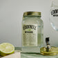 700ml Jar Lime Moonshine next to a Spritz glass and pouring lid