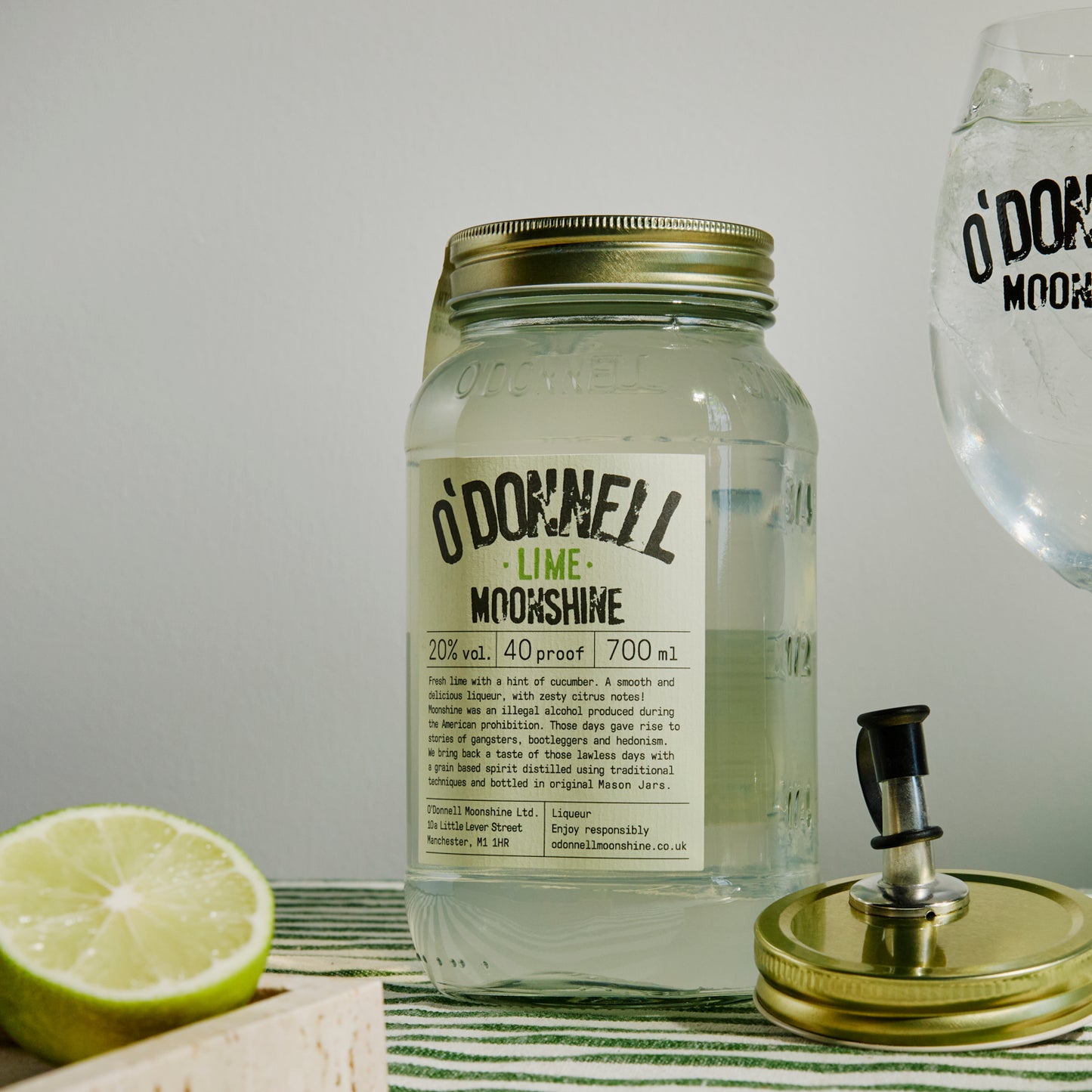 700ml Jar Lime Moonshine next to a Spritz glass and pouring lid