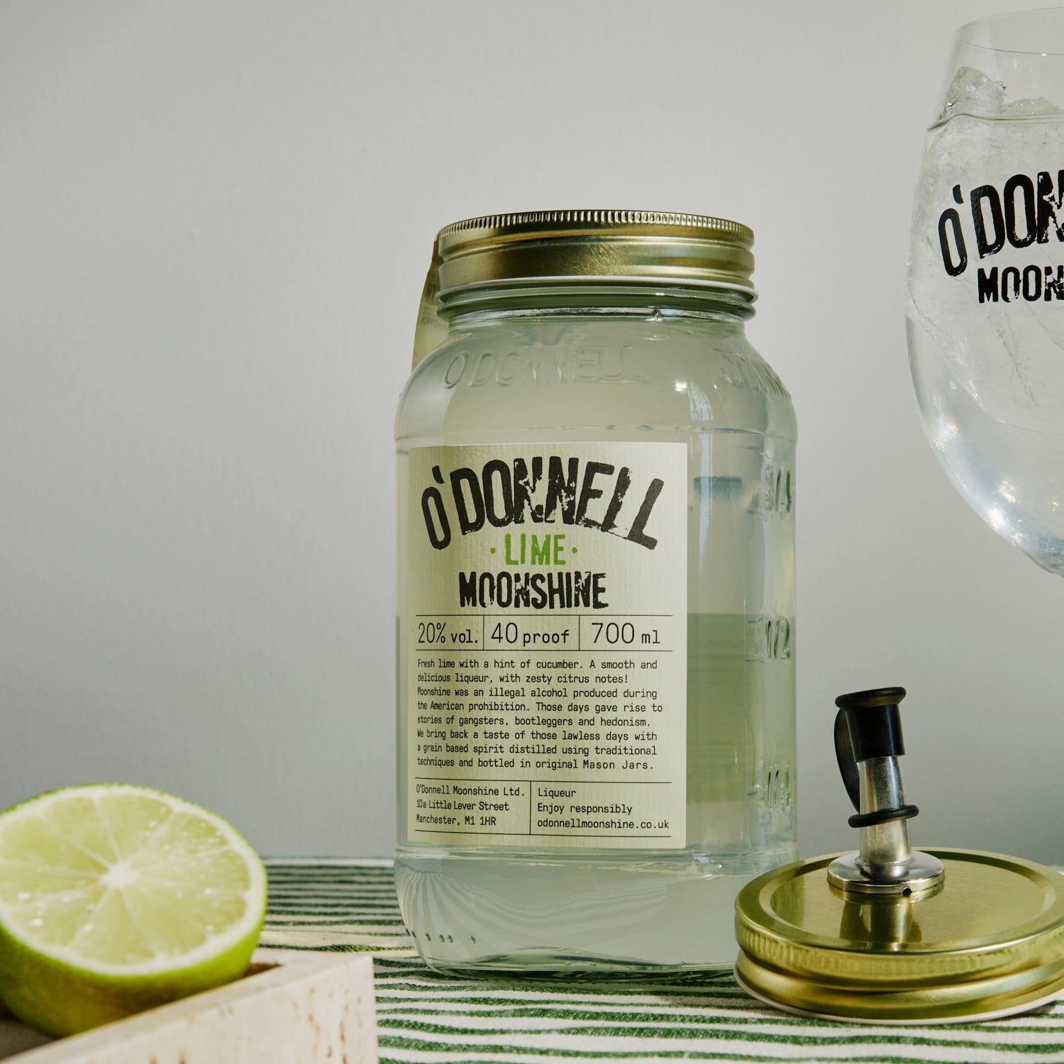 700ml Jar Lime Moonshine next to a Spritz glass and pouring lid