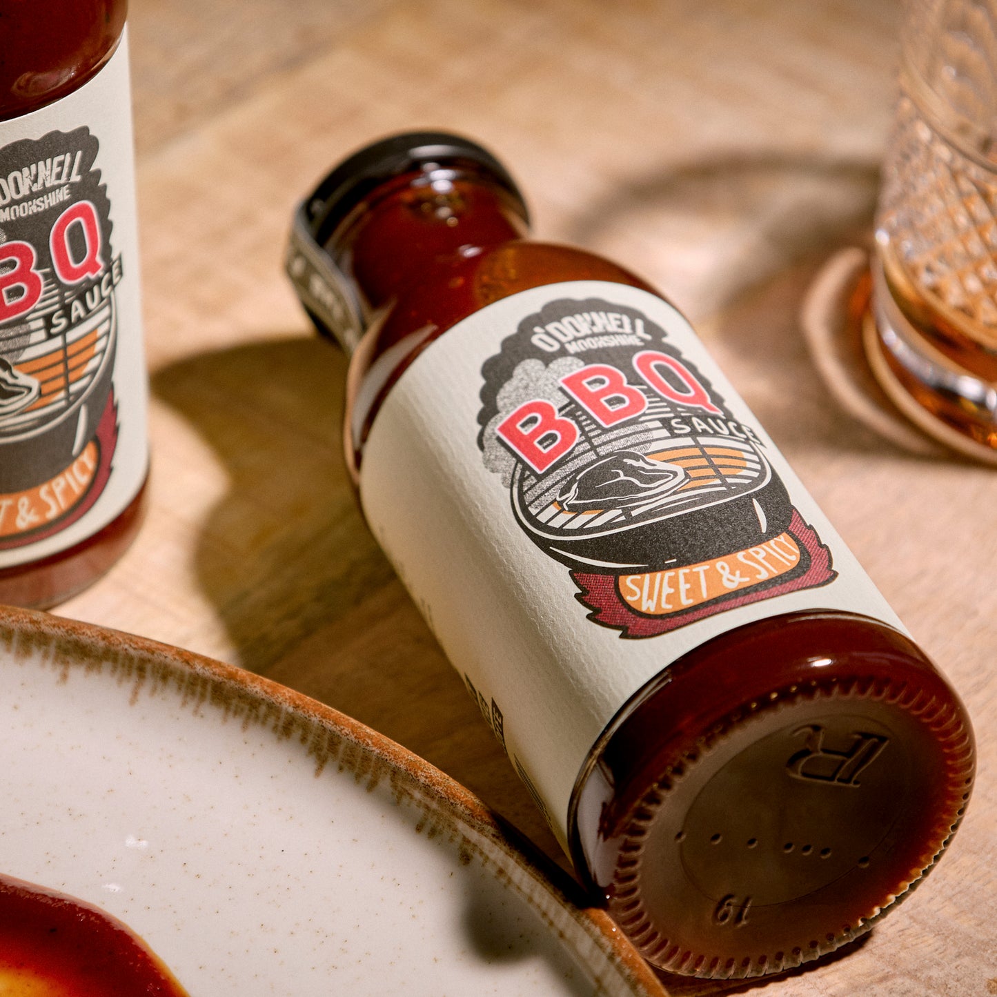 Bottle of Sweet & Spicy BBQ sauce on a wooden table
