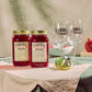 Two O'Donnell Sprit Glasses next to 2 700ml Jars of Pomegranate Moonshine and a pouring lid