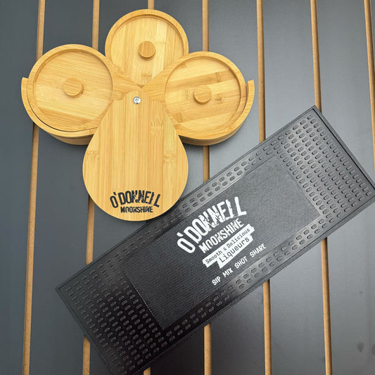 Salt rimmer and a black bar mat on a black background