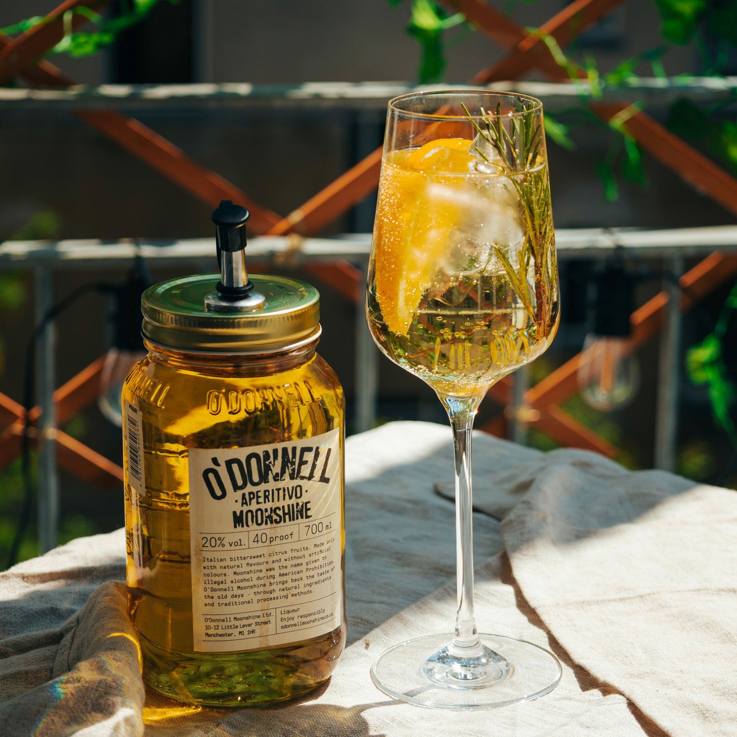 700ml jar of Aperitivo next to a spritz cocktail