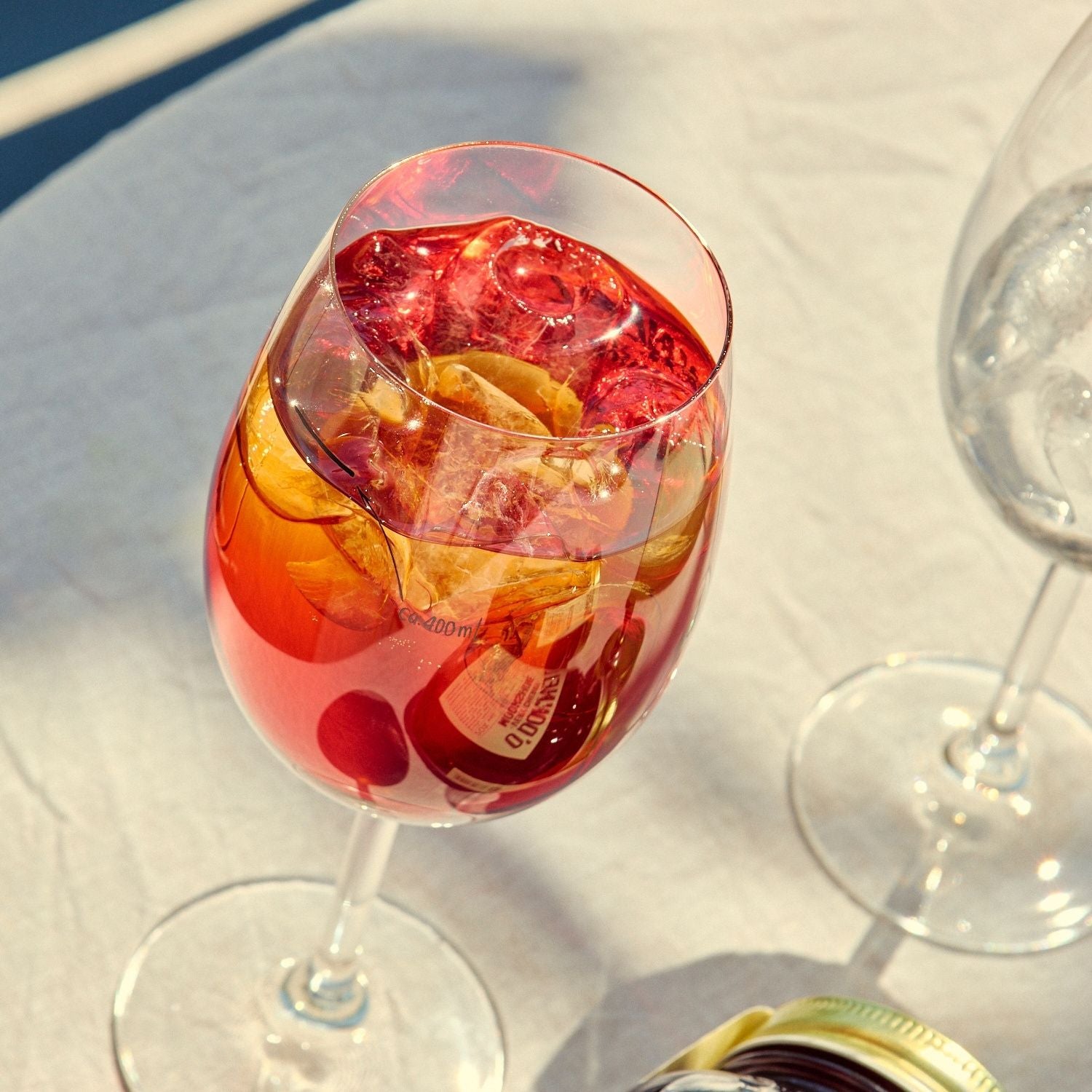Two O'Donnell Sprit Glasses  one is filled with Very Cherry Spritz