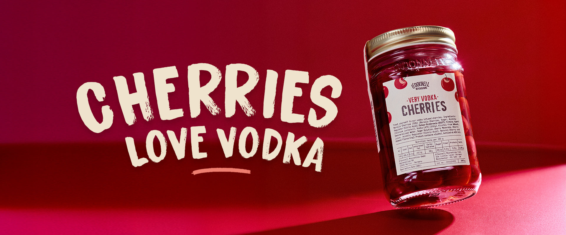 Jar of cherries with 'Cherries Love Vodka' text on a red background