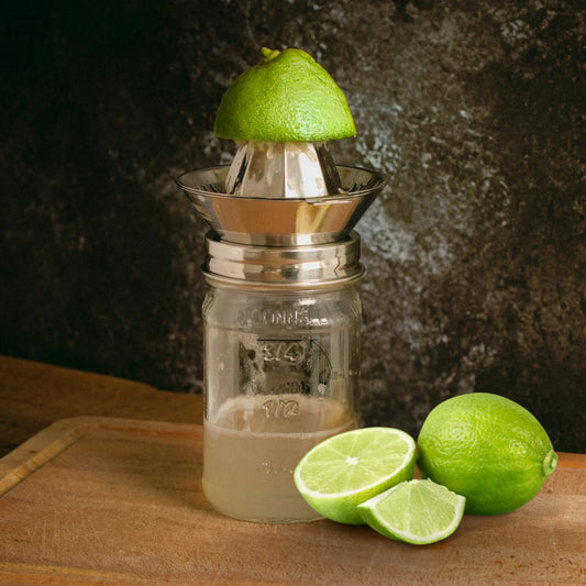 Juicer lid attachment shown on a mason jar