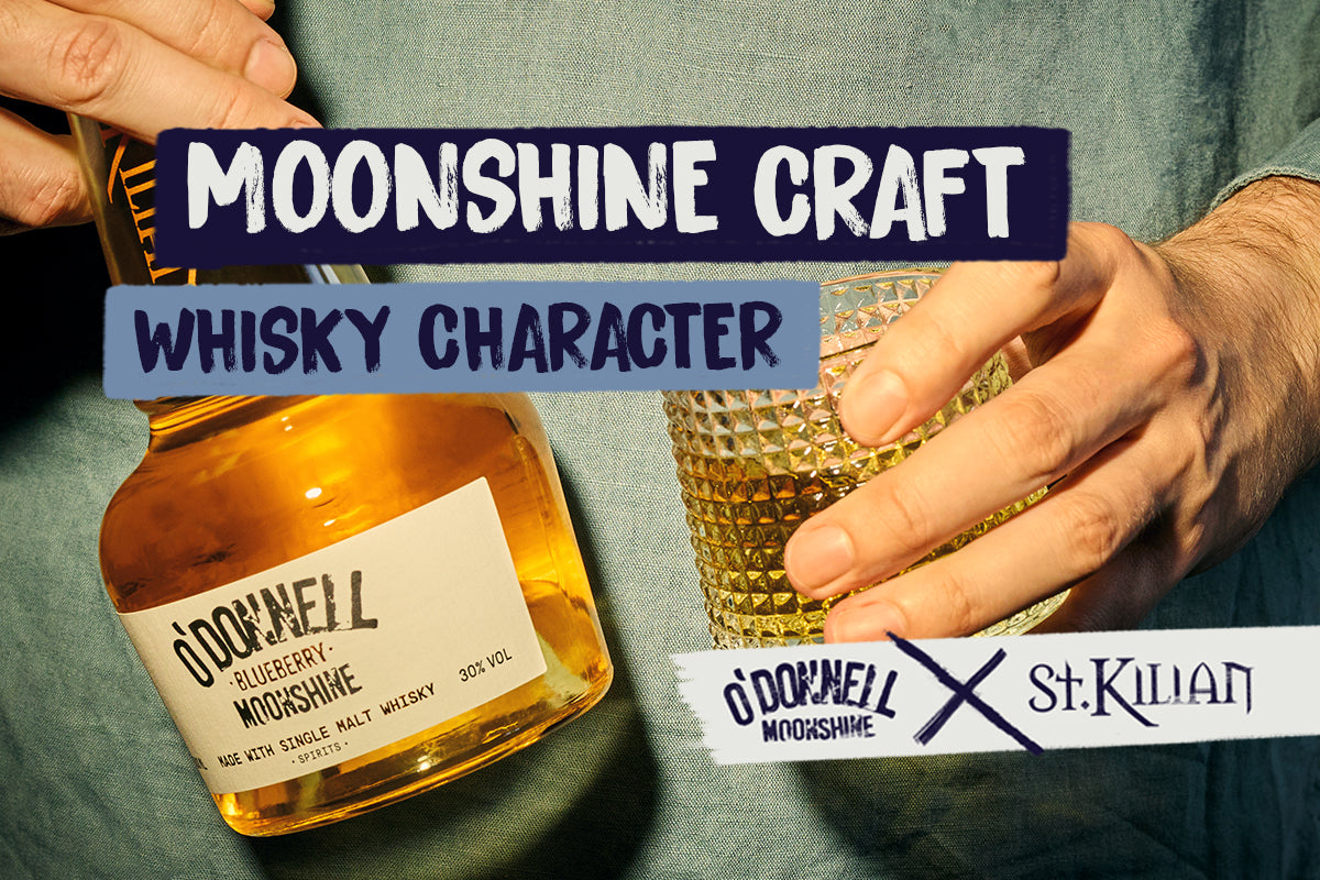 person holding blueberry moonshine whisky bottle and tumbler. with the text moonshine craft whisky character 