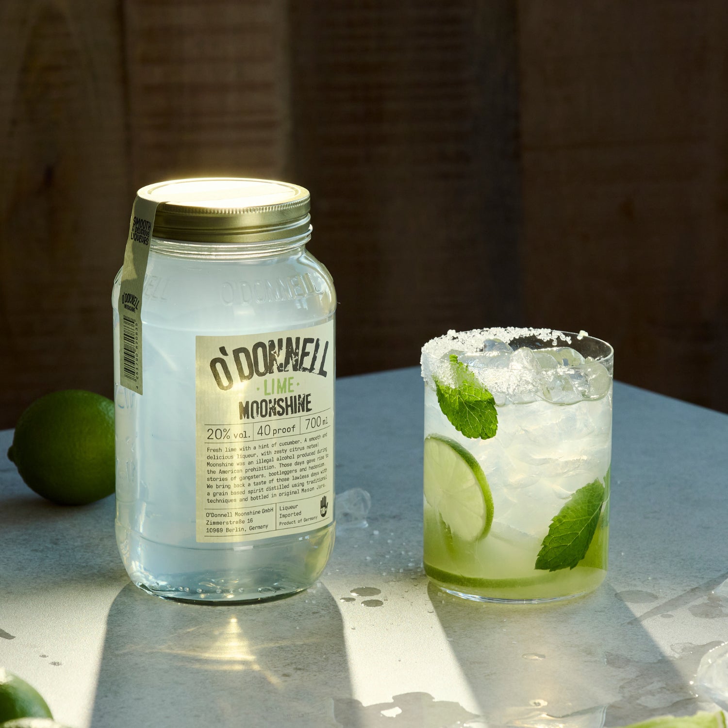 Lime Moonshine next to a mojito