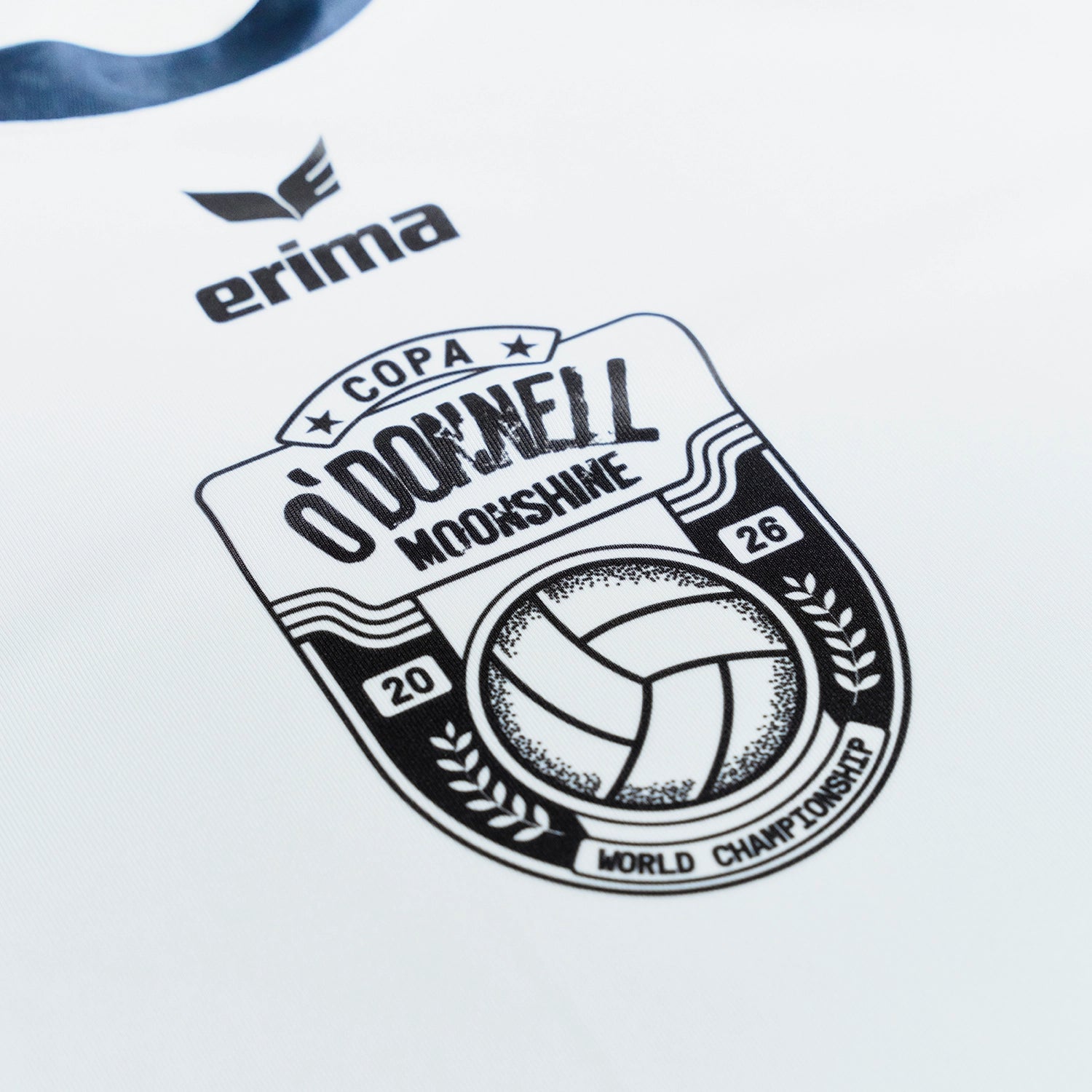 O'Donnell Moonshine WM Football Jersey – detailed close-up of Copa World Championship badge with O'Donnell Moonshine lettering and football graphic