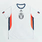 O'Donnell Moonshine WM Football Jersey – front flat lay showing Erima x O'Donnell Moonshine badge, orange side stripes and navy trim, white background
