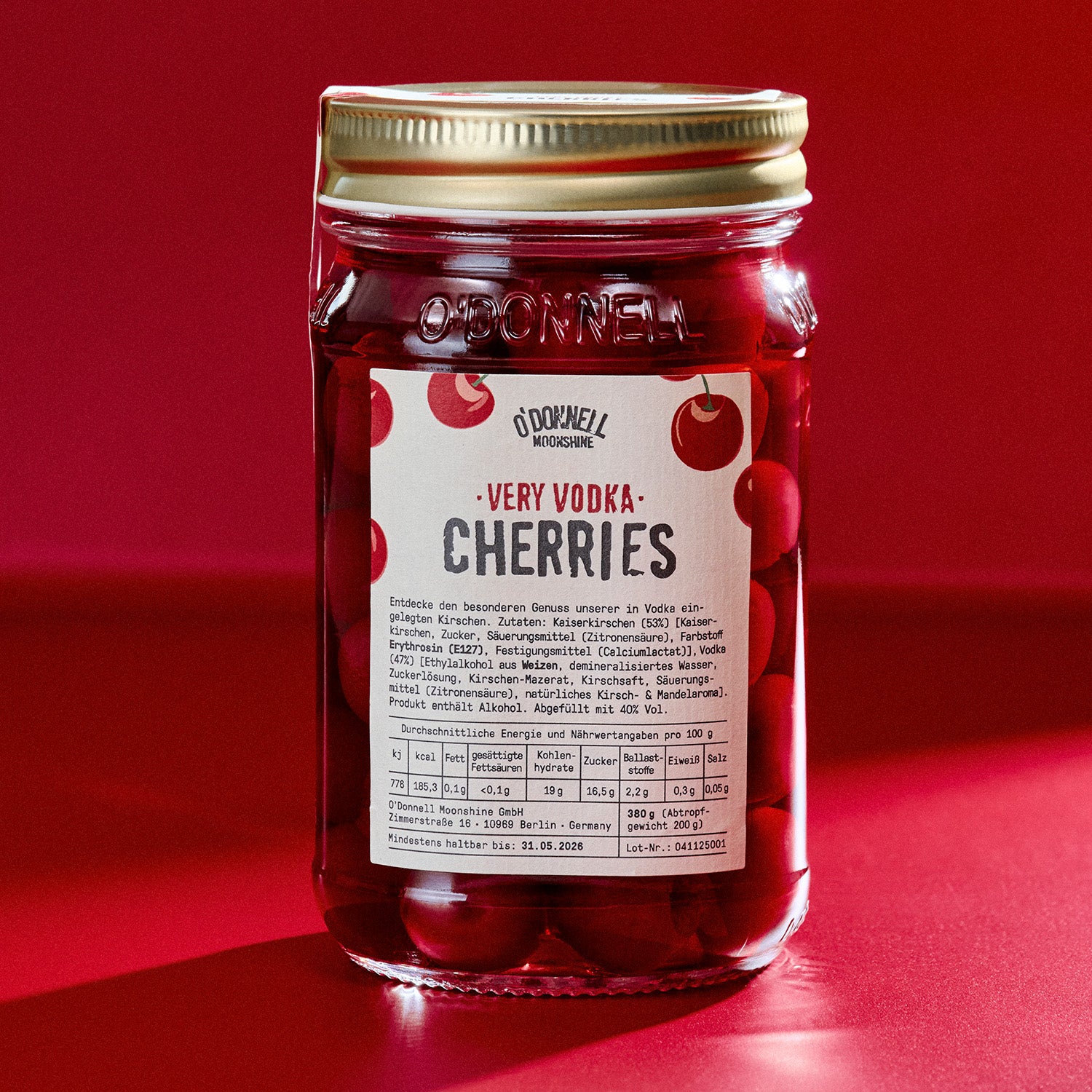 Jar of O'Donnell Very Vodka Cherries on a red background
