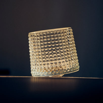 Textured Tumbler Glass on a dark background