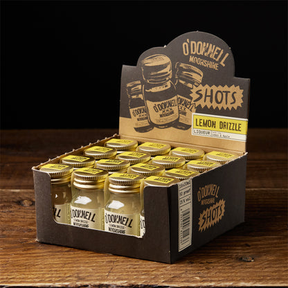 A box of O'Donnell Micro Moonshine shots displayed on a wooden surface - flavour lemon drizzle