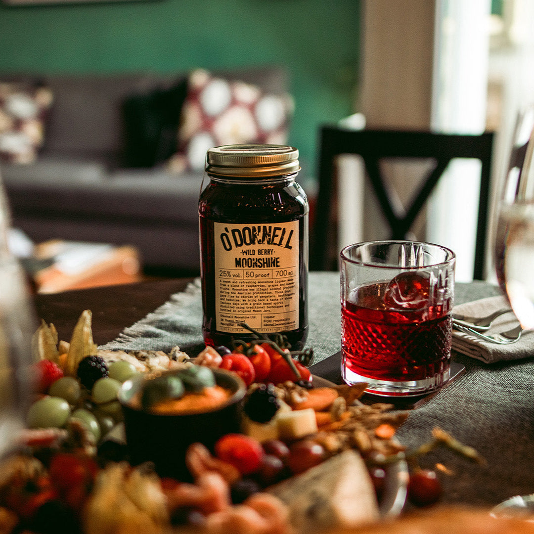 wild berry on a table with a cocktail