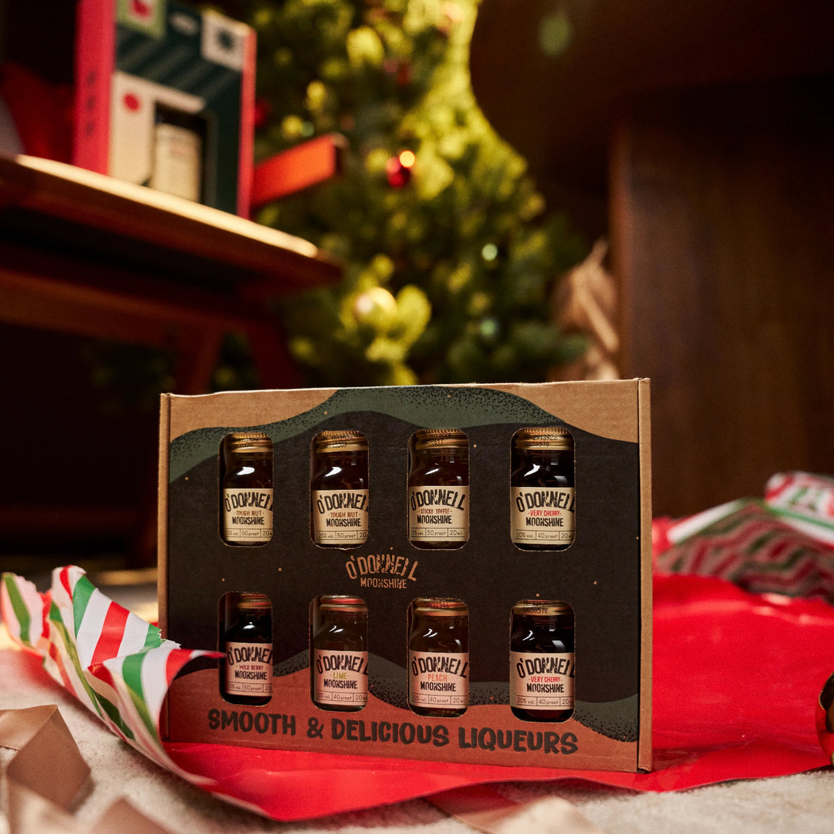 O'Donnell Moonshine Christmas Baubles in front of a christmas tree.