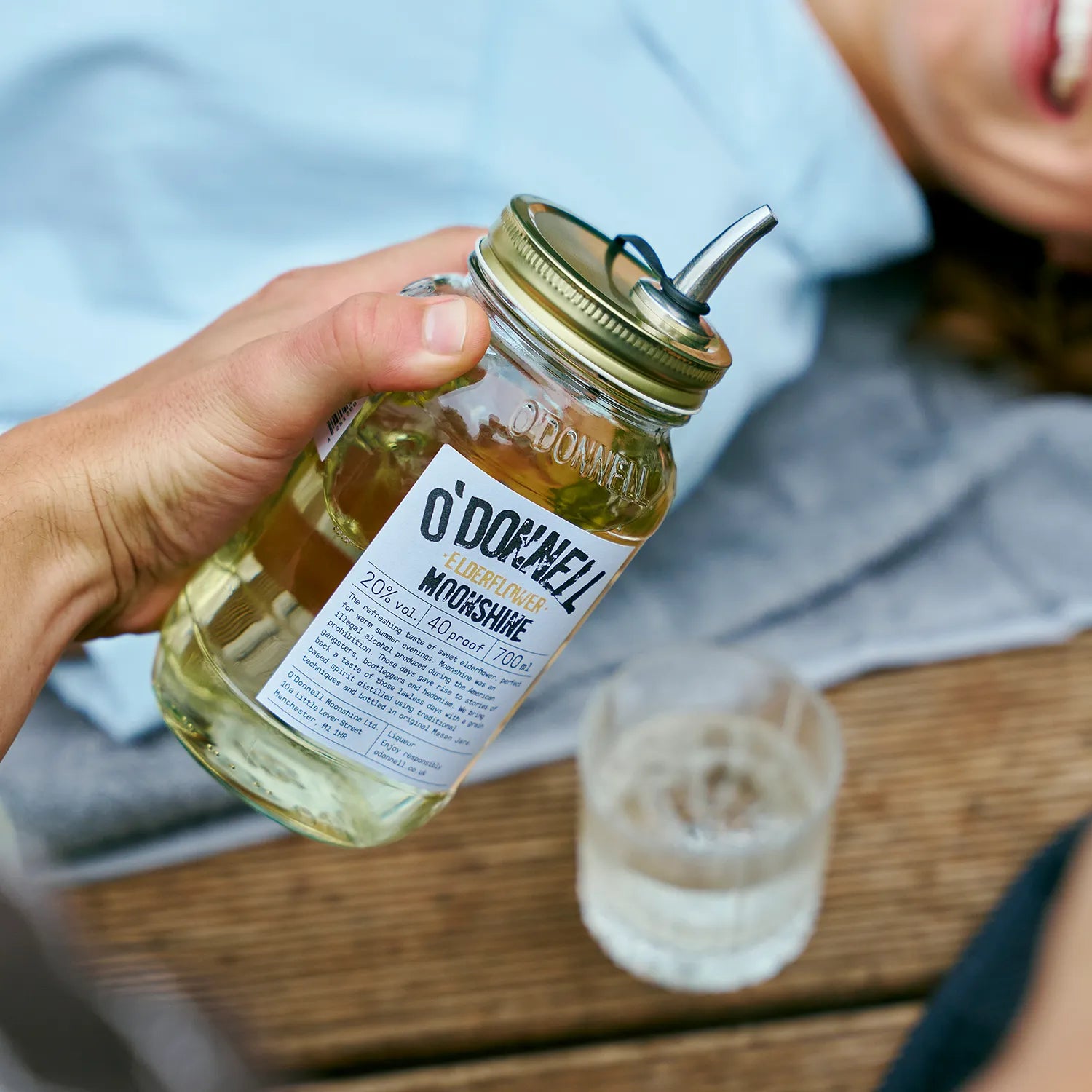 O'Donnell Moonshine  Elderflower liqueur, with a Mason jar in front of a poured shot.