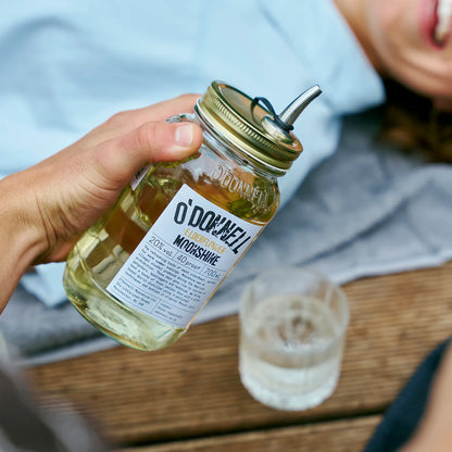 O'Donnell Moonshine  Elderflower liqueur, with a Mason jar in front of a poured shot.