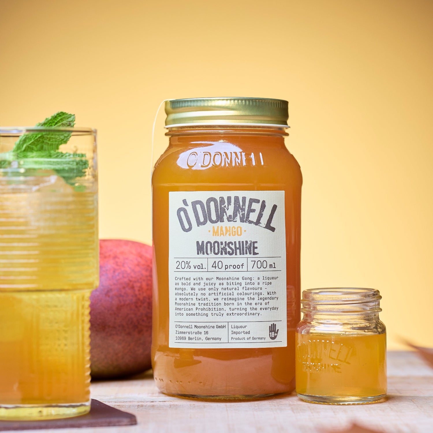 The O'Donnell Moonshine Mango placed beside a cocktail and a shot.