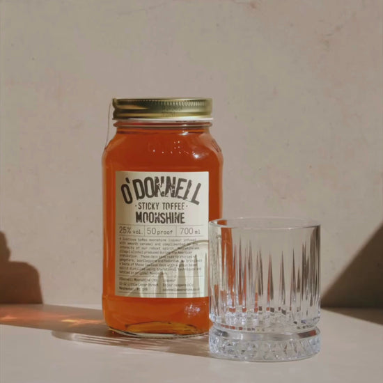 sticky toffee moonshine being poured