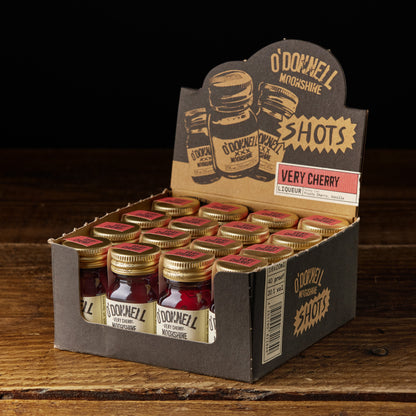A box of O'Donnell Micro Moonshine shots displayed on a wooden surface - flavour very cherry