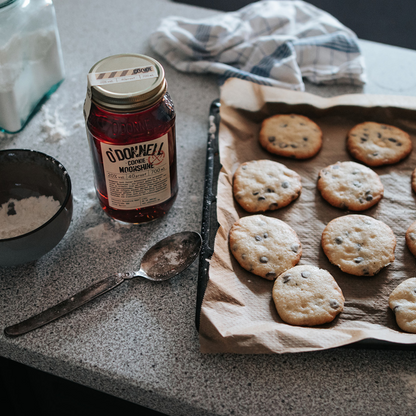 O'Donnell Moonshine Cookie mood image, with moonshine jar and batch of fresh cookies